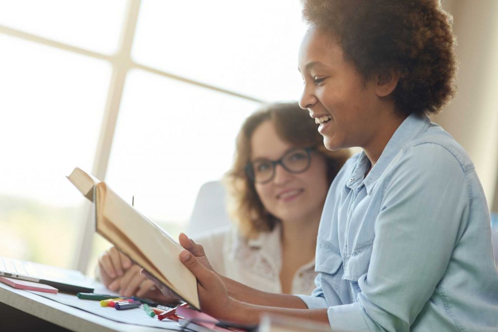 Woman reading her story out loud to someone she trusts