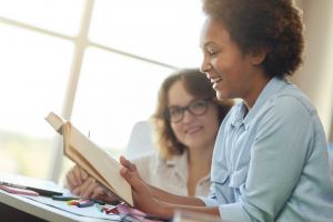 Woman reading her story out loud to someone she trusts