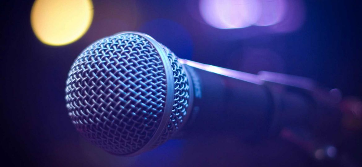 Microphone on a stand in purple light