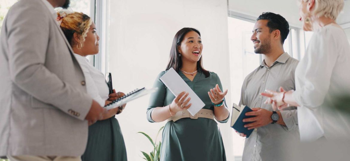 Woman speaking with a group as a thought leader